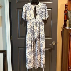 Very cute dress.  Rumor long dress with shorts, ties in the back.